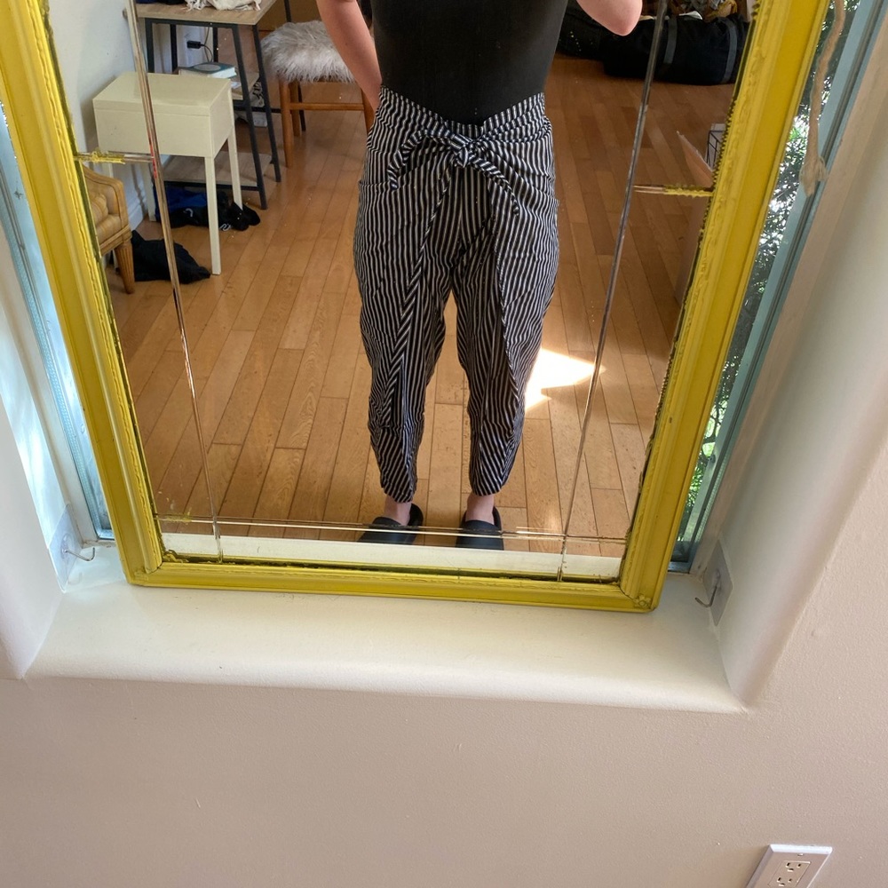 Black and white pinstriped conductor pants